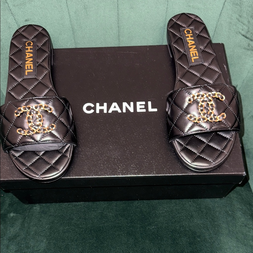 CHANEL Black Quilted Slides with Gold Chain